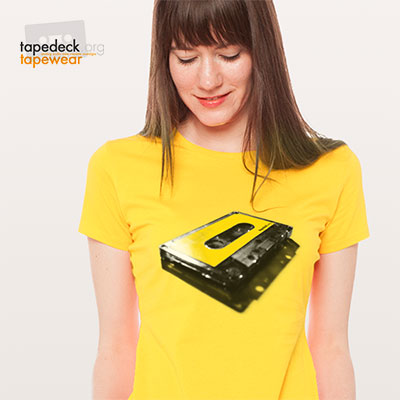 show your love for tapes with this original vintage grey transparent audio cassette with prominent yellow label. wear it proud.